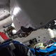 NASA astronauts inspecting the Starliner interior, with Rosie the Rocketeer (a manikin) still strapped to her seat.